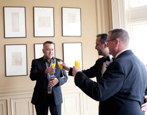 Nasir & Mark at The Whitney Restaurant Detroit LGBTQ wedding photograph