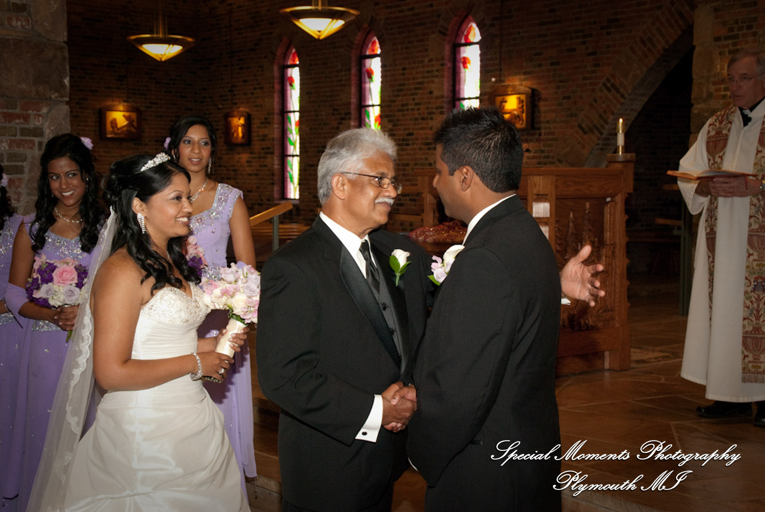 Sean & Bin at St. Joseph Lake Orion MI wedding photograph