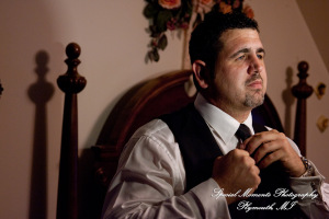 The couple at home getting ready wedding photograph