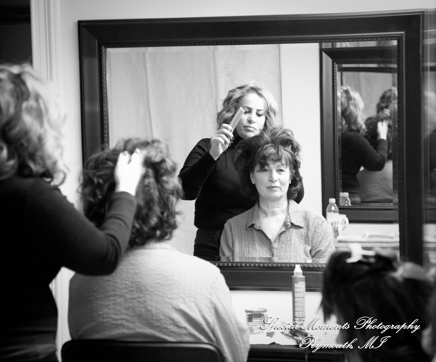 The couple at home getting ready wedding photograph