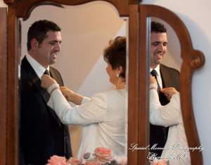The couple at home getting ready wedding photograph