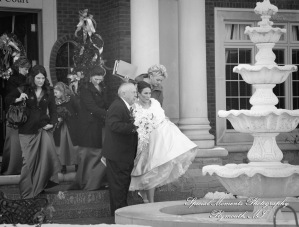 The couple at home getting ready wedding photograph