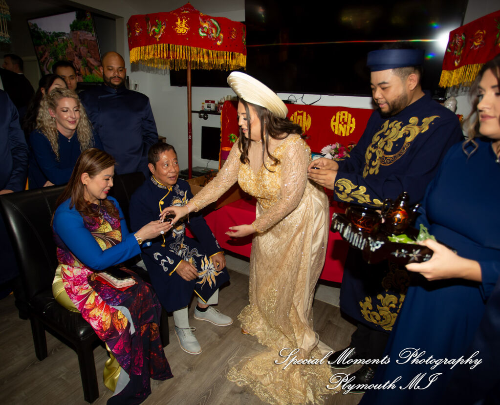 Jimmy & Gina Close up of a bride and groom catching dates and chestnuts in a silk blanket during a Troy Michigan Korean wedding ritual. Jimmy & Gina Close up of a bride and groom catching dates and chestnuts in a silk blanket during a Troy Michigan Korean wedding ritual.