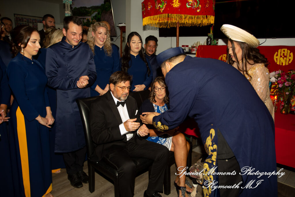 Gina & Jimmy: A high-density family living room in Troy MI packed with over 100 guests witnessing a traditional Korean Paebaek wedding ceremony. Gina & Jimmy: A high-density family living room in Troy MI packed with over 100 guests witnessing a traditional Korean Paebaek wedding ceremony.
