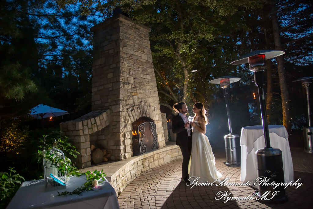 Newlyweds dancing their first dance at night on the twinkle-lit outdoor patio at Cafe Cortina in Farmington Hills Michigan. Newlyweds dancing their first dance at night on the twinkle-lit outdoor patio at Cafe Cortina in Farmington Hills Michigan.