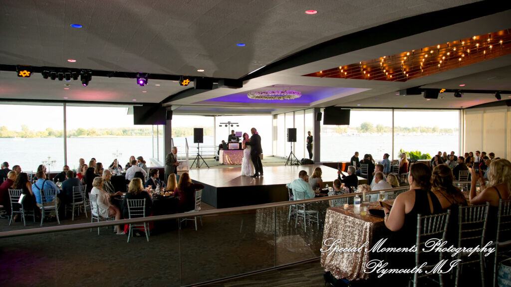 Newlyweds dancing on the famous elevated rising dance floor during a wedding reception at The Roostertail in Detroit.