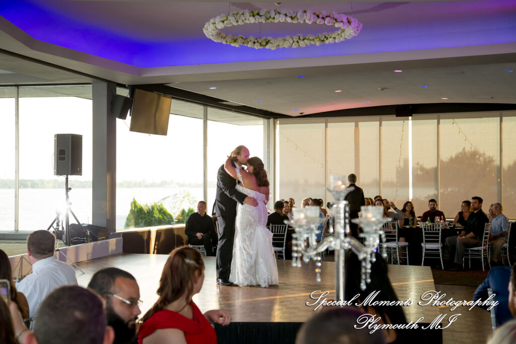 Newlyweds dancing on the famous elevated rising dance floor during a wedding reception at The Roostertail in Detroit.
