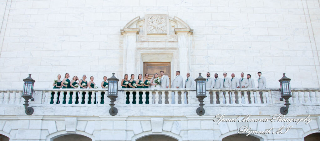 Kristine & Robert: The complete bridal party poses on the historic marble steps of the Detroit Institute of Arts during a wedding portrait session. Kristine & Robert: The complete bridal party poses on the historic marble steps of the Detroit Institute of Arts during a wedding portrait session.