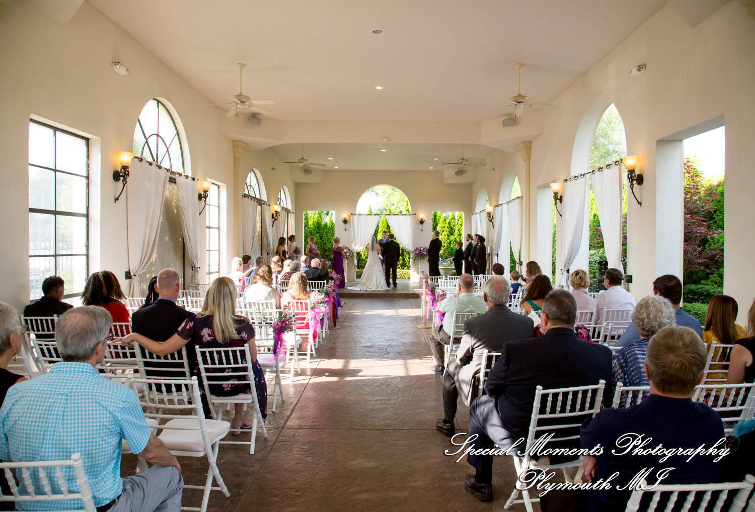 Tonya and Kevin exchange vows during their outdoor gazebo wedding ceremony at Crystal Gardens Event Center in Howell MI.