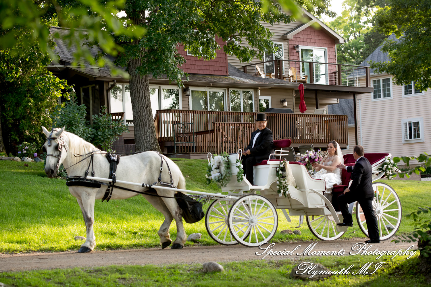 Tonya and Kevin enjoy a classic horse and carriage ride along the scenic perimeters of Lake Chemung in Howell Michigan.