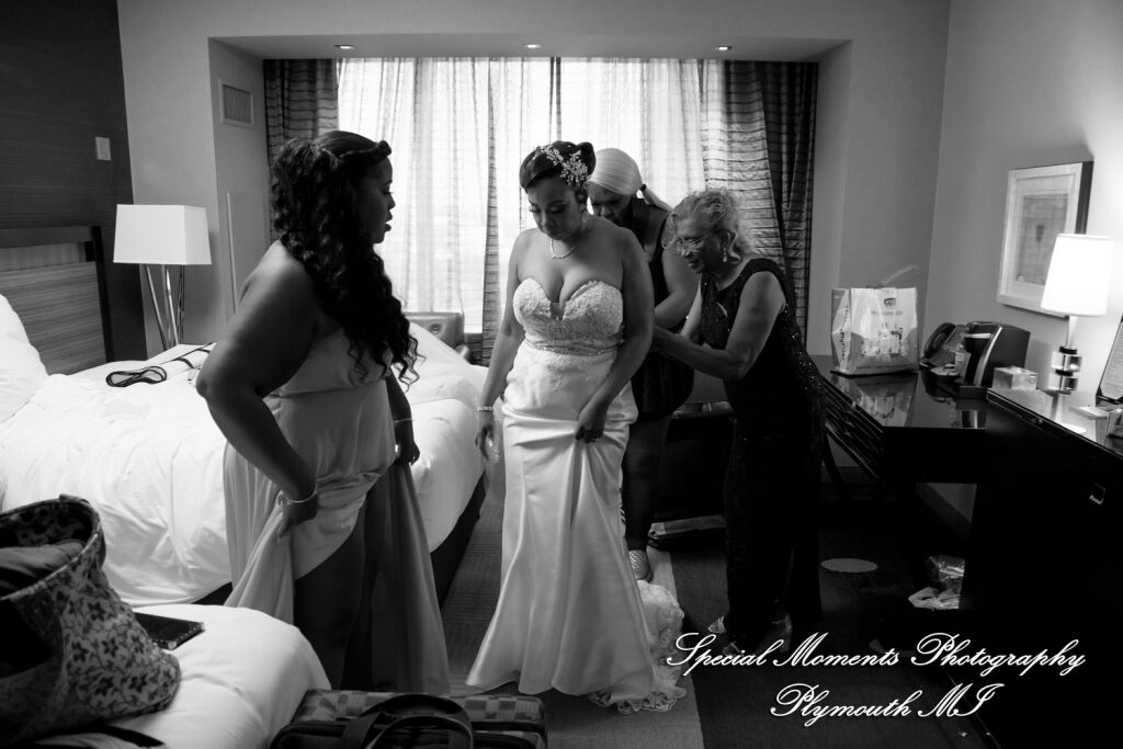 Bride Tameka shares a relaxed moment with her bridesmaids inside a modern hotel suite at MGM Grand Detroit. Bride Tameka shares a relaxed moment with her bridesmaids inside a modern hotel suite at MGM Grand Detroit.