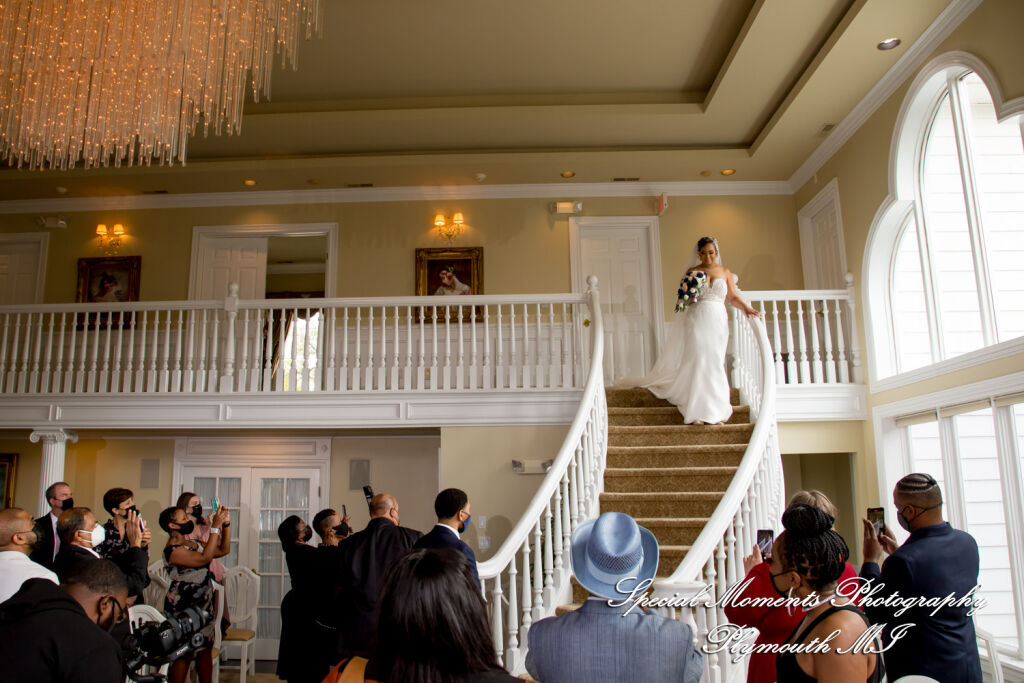 Bride Tameka descends the grand curved staircase during her wedding processional at the White House Wedding Chapel. Bride Tameka descends the grand curved staircase during her wedding processional at the White House Wedding Chapel.