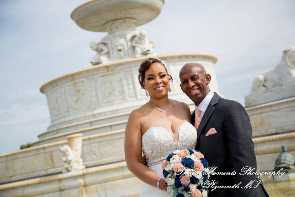 Tameka and James stand in front of the grand historic architectural fountain on Belle Isle in Detroit MI. Tameka and James stand in front of the grand historic architectural fountain on Belle Isle in Detroit MI.
