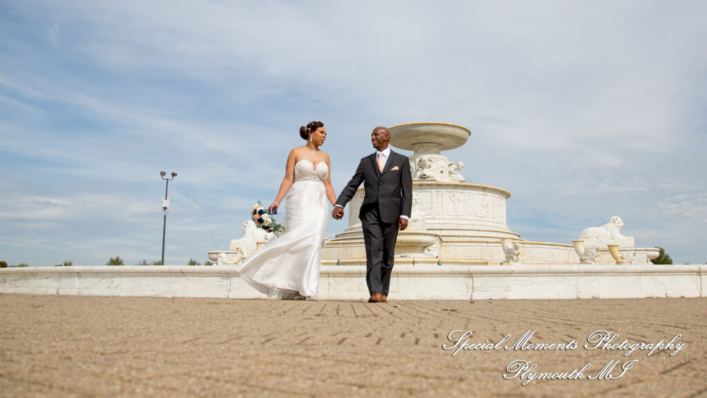Tameka and James walk hand-in-hand through the park outdoor on Belle Isle in Detroit MI. Tameka and James walk hand-in-hand through the park outdoor on Belle Isle in Detroit MI.