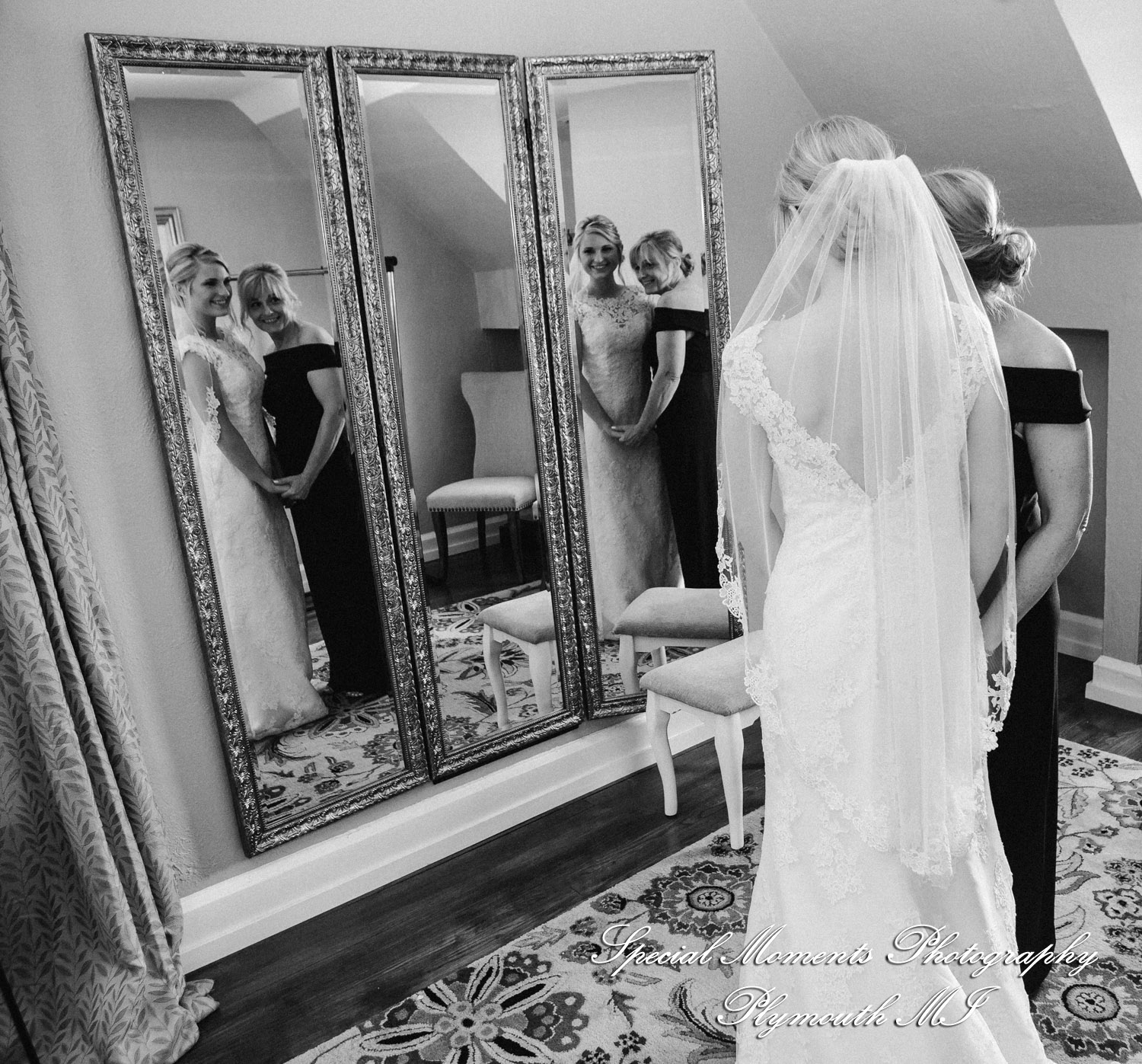 Meghan shares a deeply emotional first look with her mother in the upper-level suite of the Glen Oaks Event Center in Farmington Hills.