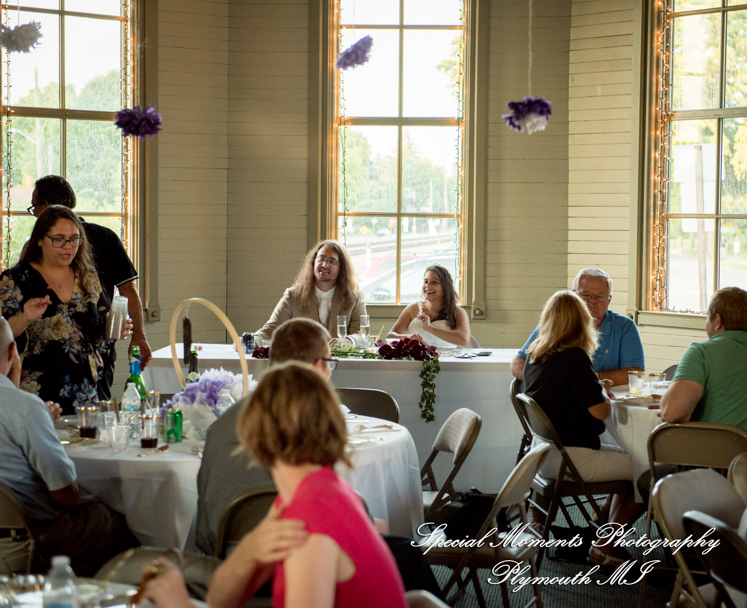 Family members deliver emotional and meaningful toasts during the rustic wedding reception at the Chelsea Train Depot.