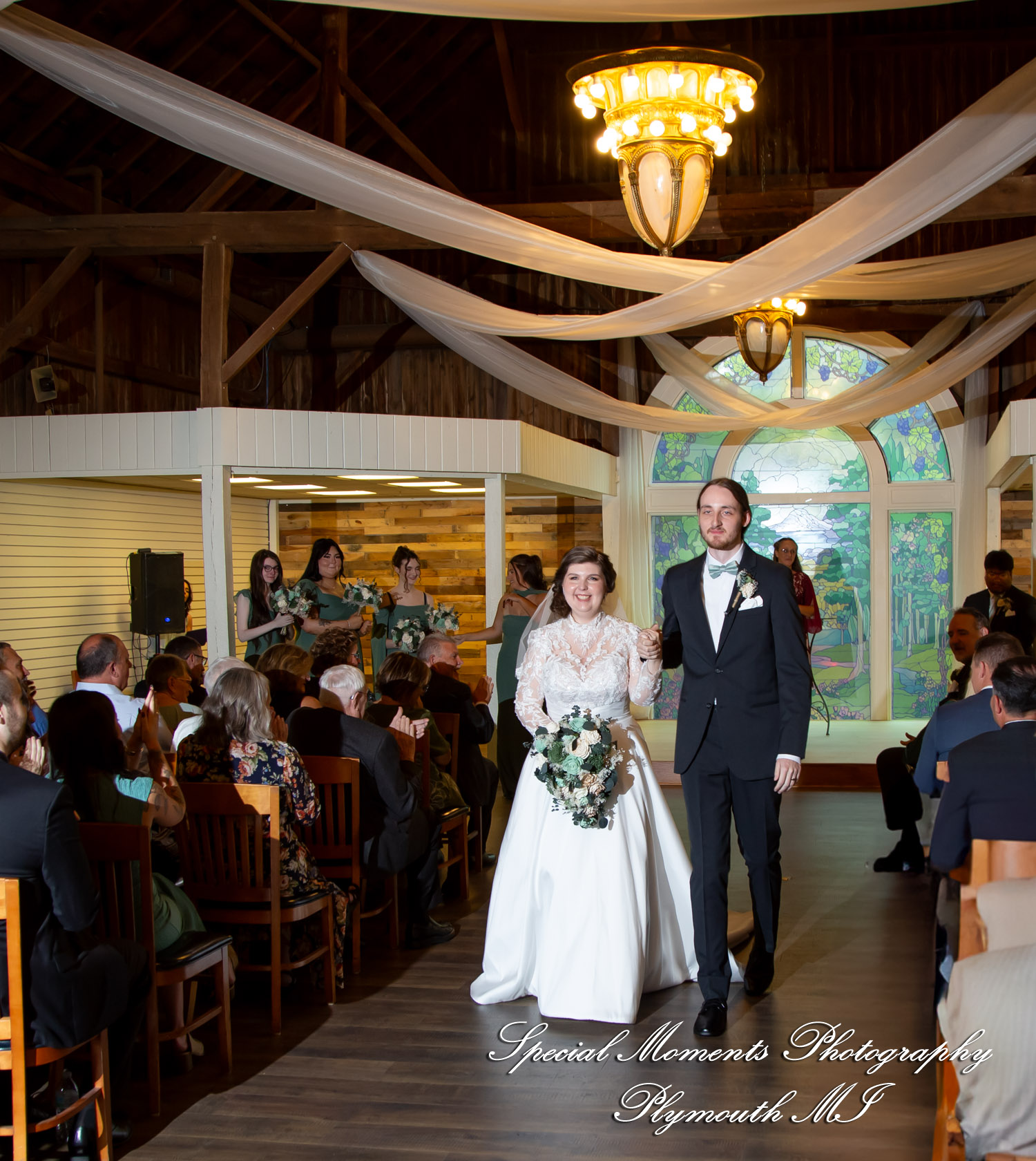 Maureen and Bailey walk down the aisle together following their ceremony at the Canterbury Village Wedding Chapel.