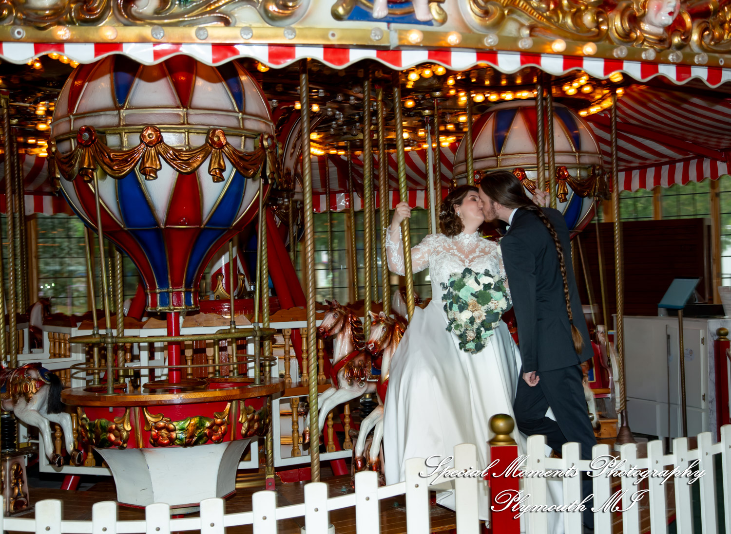 Maureen and Bailey share a playful moment together on the historic carousel on the grounds of Canterbury Village.