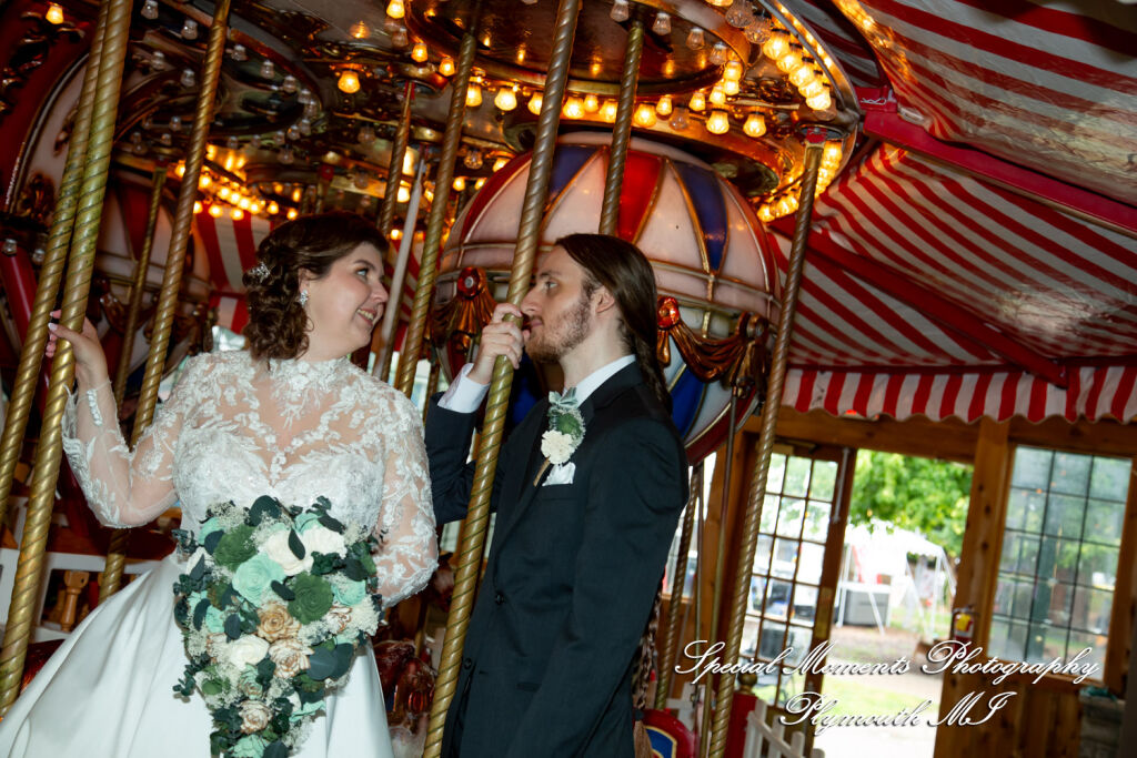 Maureen and Bailey share a playful moment together on the historic carousel on the grounds of Canterbury Village.